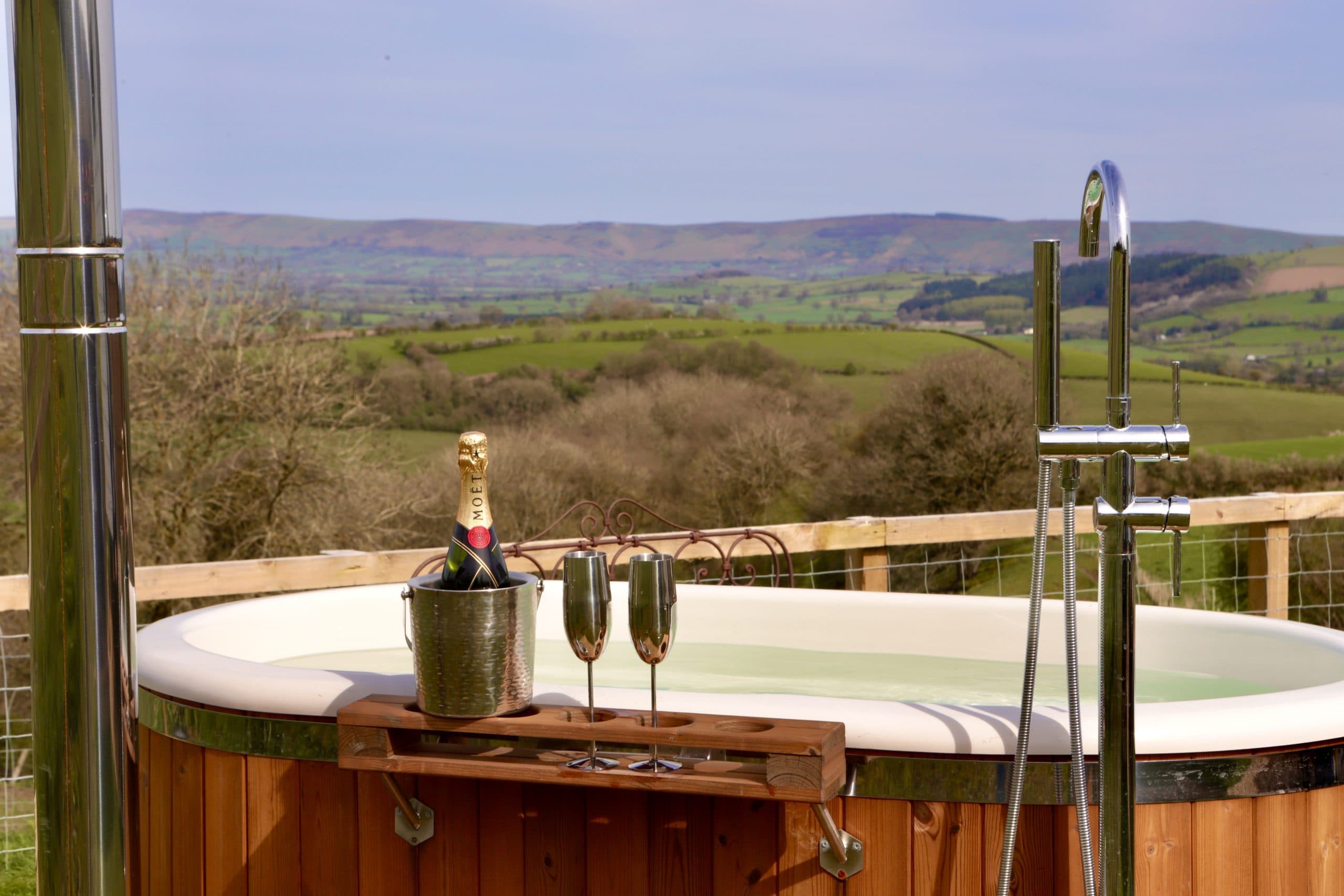 Champagne on the hot tub at Oak Hut with panoramic Shropshire views