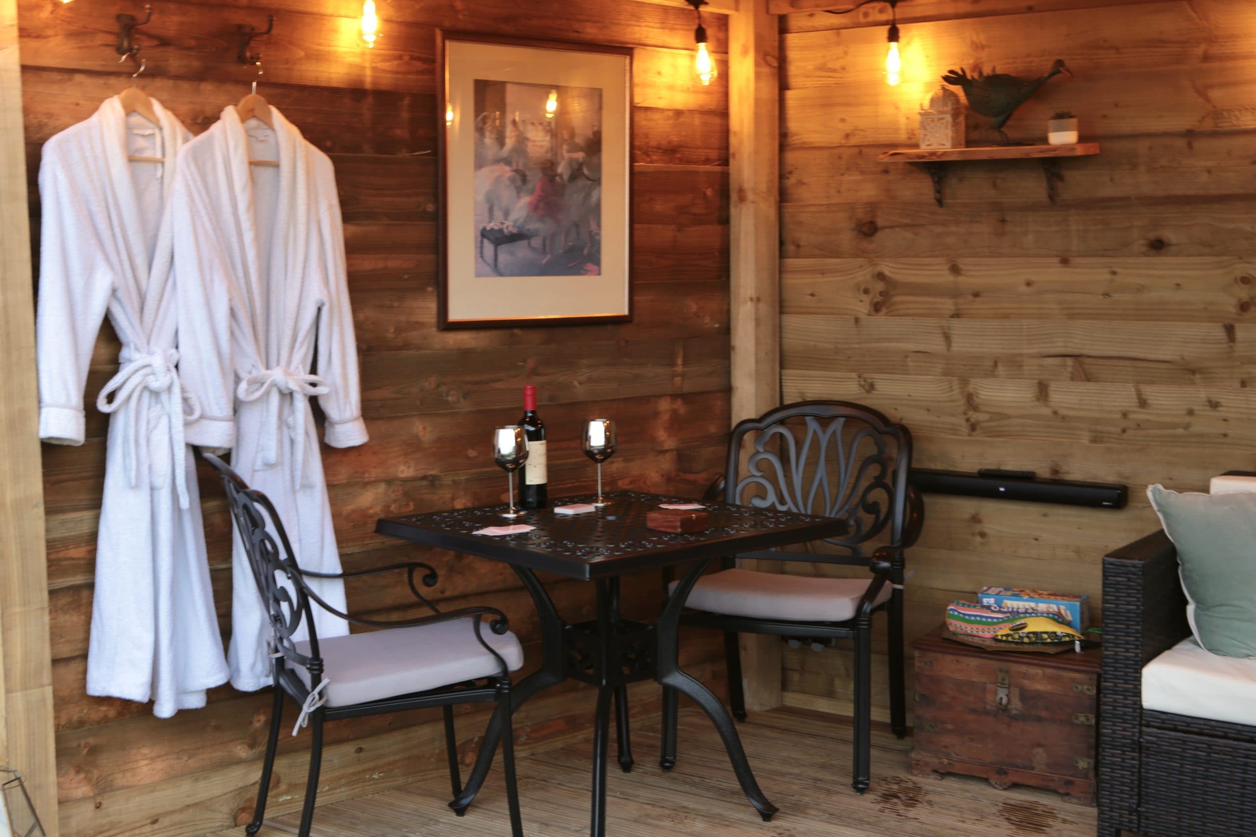 The entertainment cabin at Oak Hut with robes and wine table
