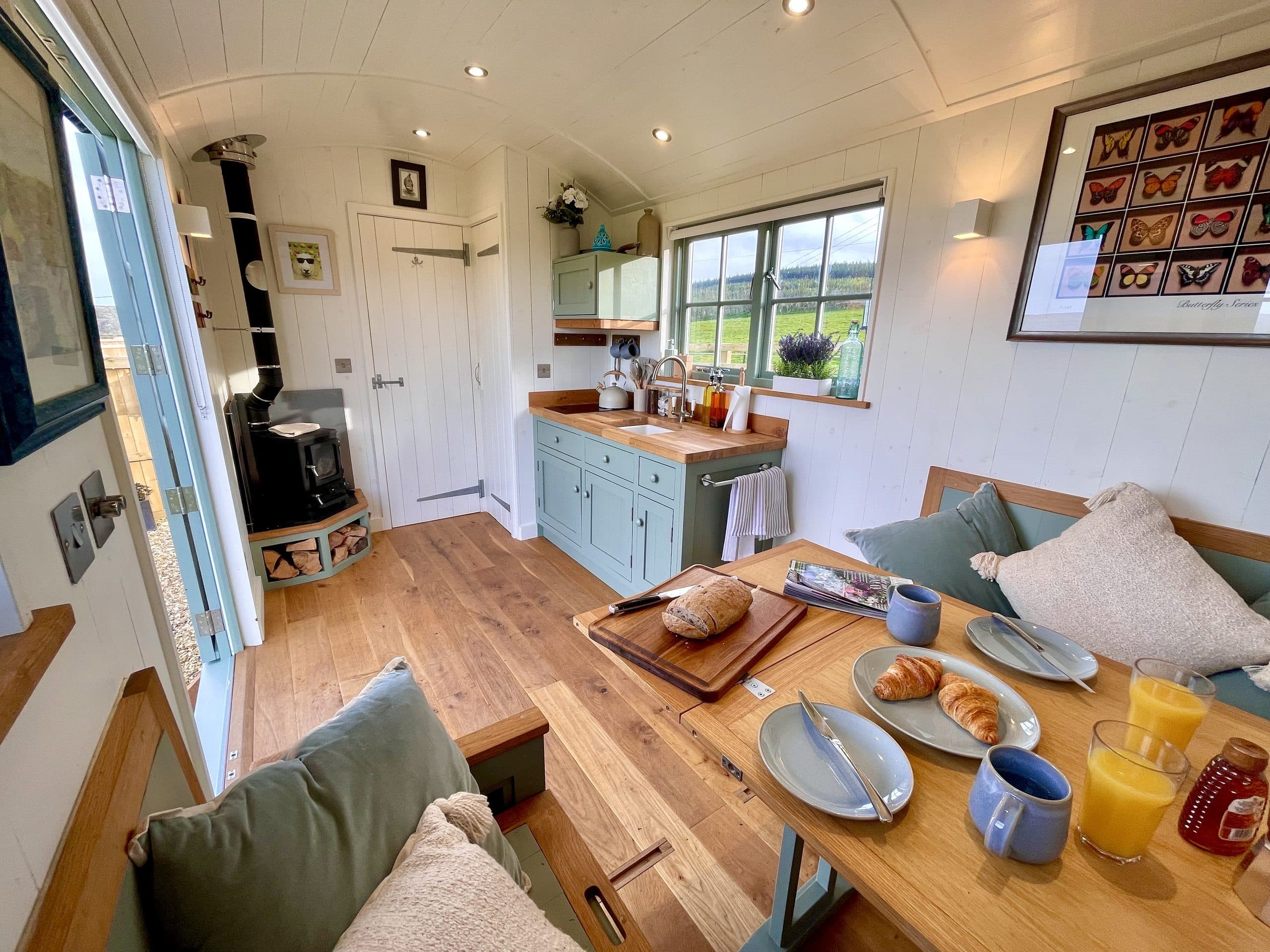 Oak Hut kitchen and breakfast table with wood burner