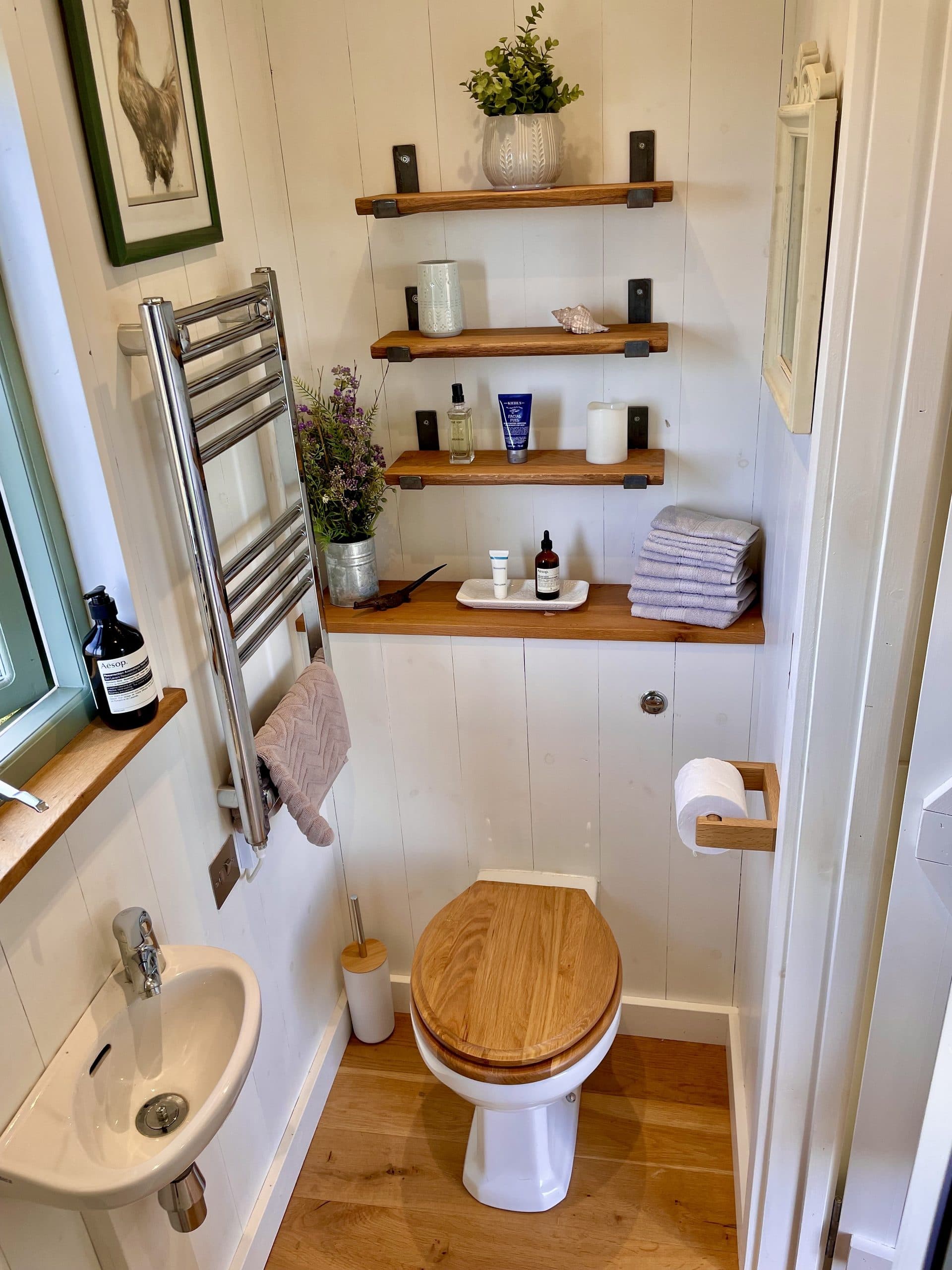 Oak Hut bathroom with shelving and toiletries