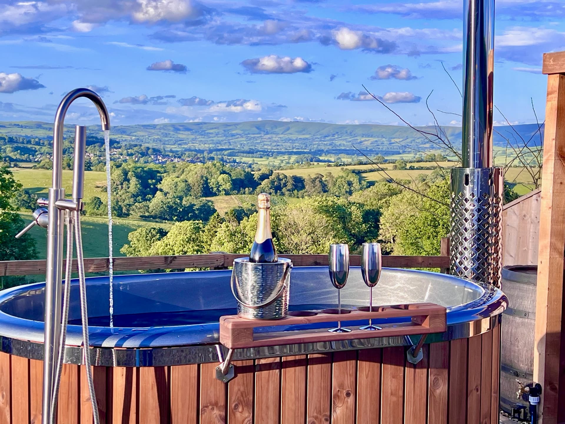 Olive Hut hot tub with champagne