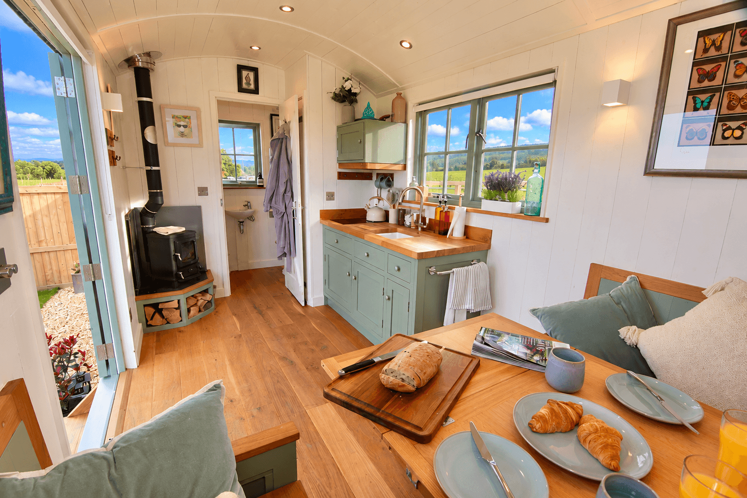 Breakfast inside Oak Hut with croissants and orange juice