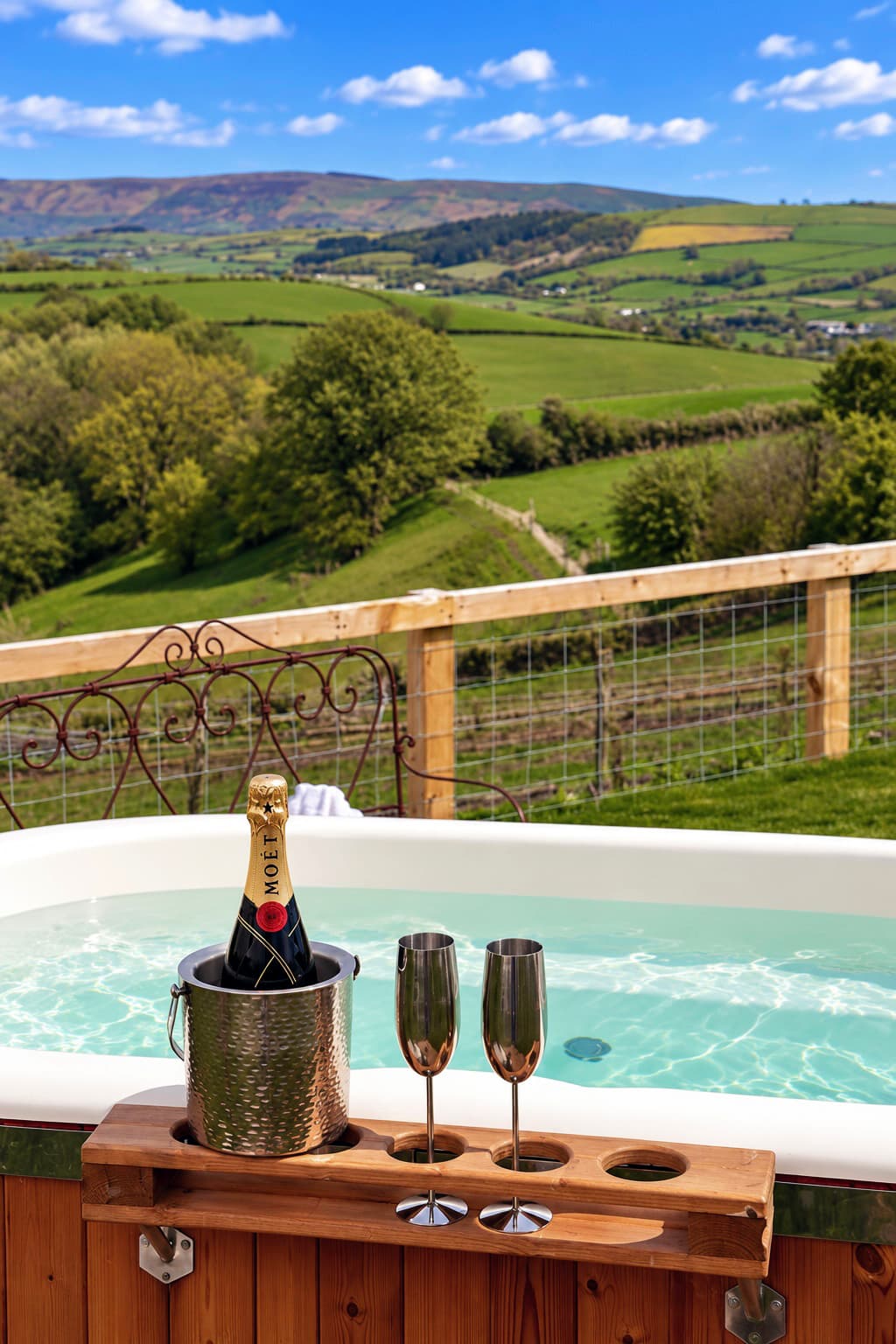 Moët champagne in hot tub at Oak Hut with panoramic countryside views