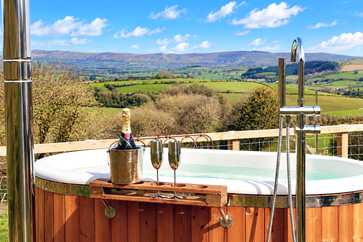 Oak Hut hot tub with Moët champagne overlooking rolling Shropshire hills